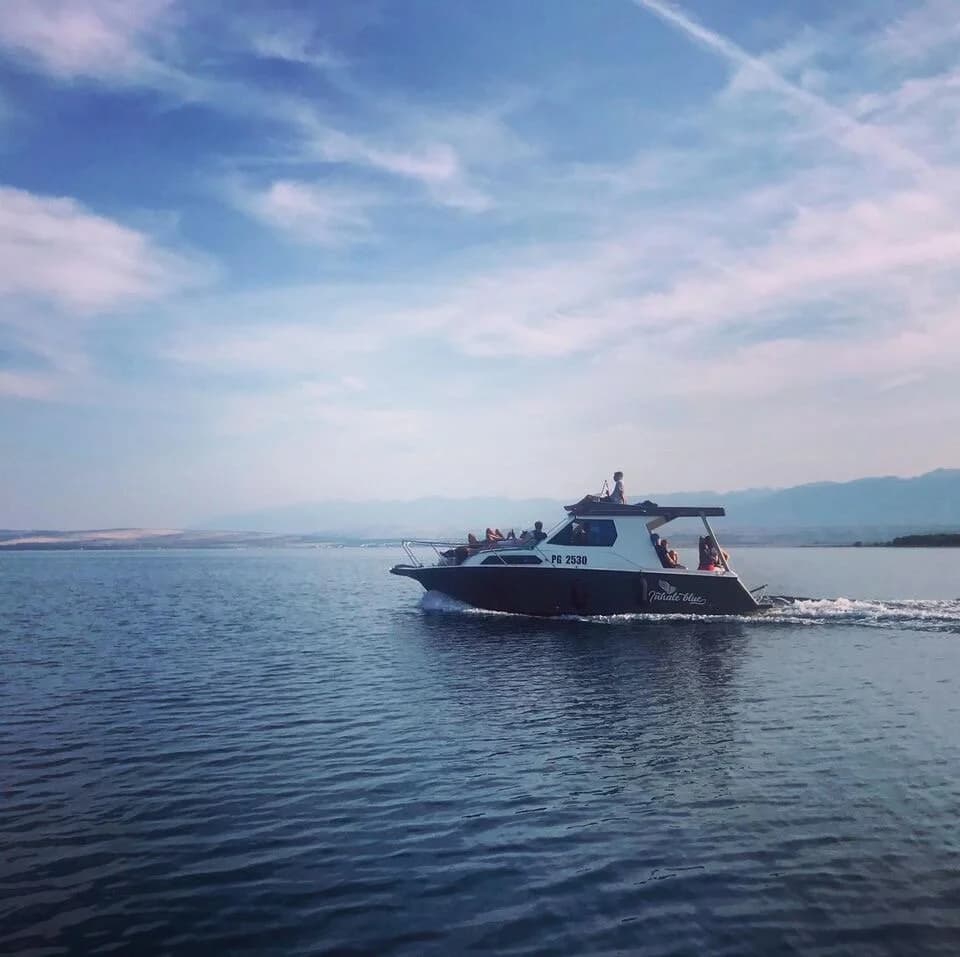 Inhale Blue boat at sunset
