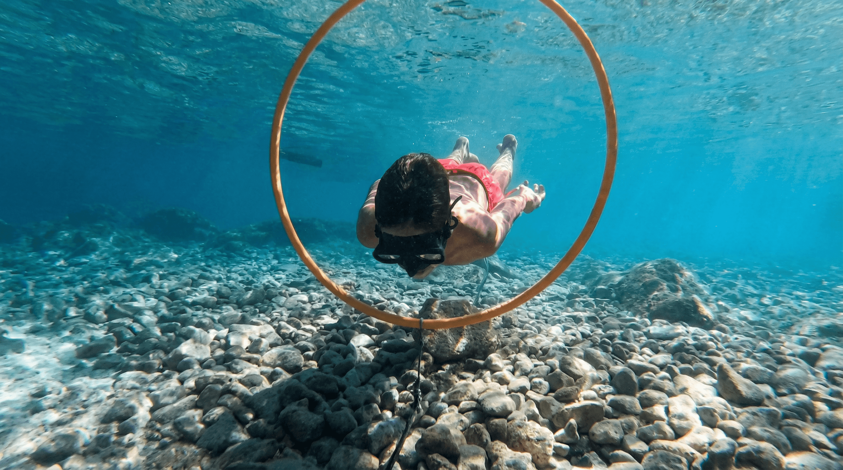 Children learning freediving in crystal clear waters of Silba, Croatia